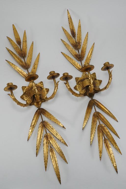 Hollywood Regency Ferrocolor Gilt Metal Sconces: Pair hand welded metal wall sconces with gold leaf finish. FERROCOLOR MADE IN SPAIN metal labels. Currently unwired. Excellent condition; old weld repair to one, some candle residue, etc. 34.75" L x 1