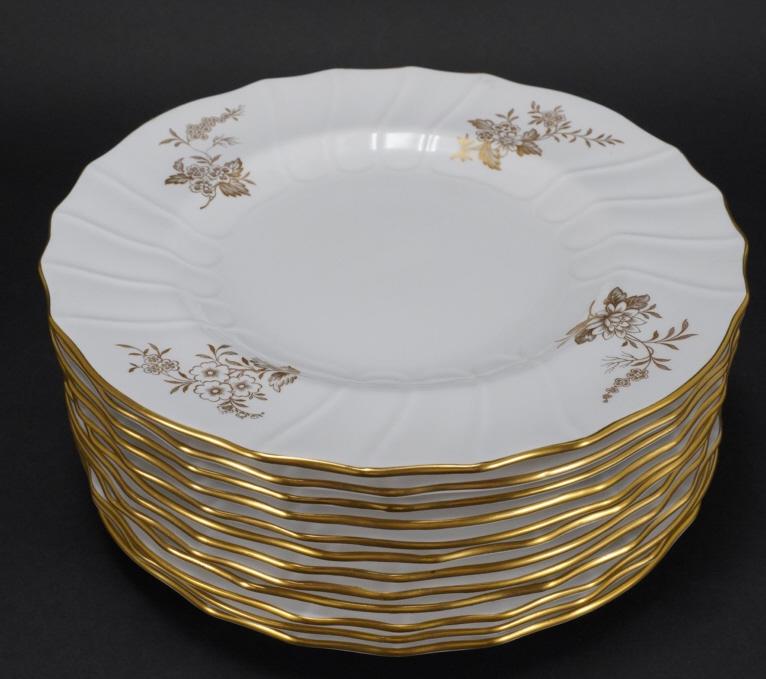 Spode Bone China LOUVAIN Dinner Plates: Set of 12 swirled scalloped bone chine dinner plates with gilt flower decorations. Gilt rim edges. Green SPODE BONE CHINA ENGLAND marks along with handwritten Y7520 H in red. Excellent like new condit