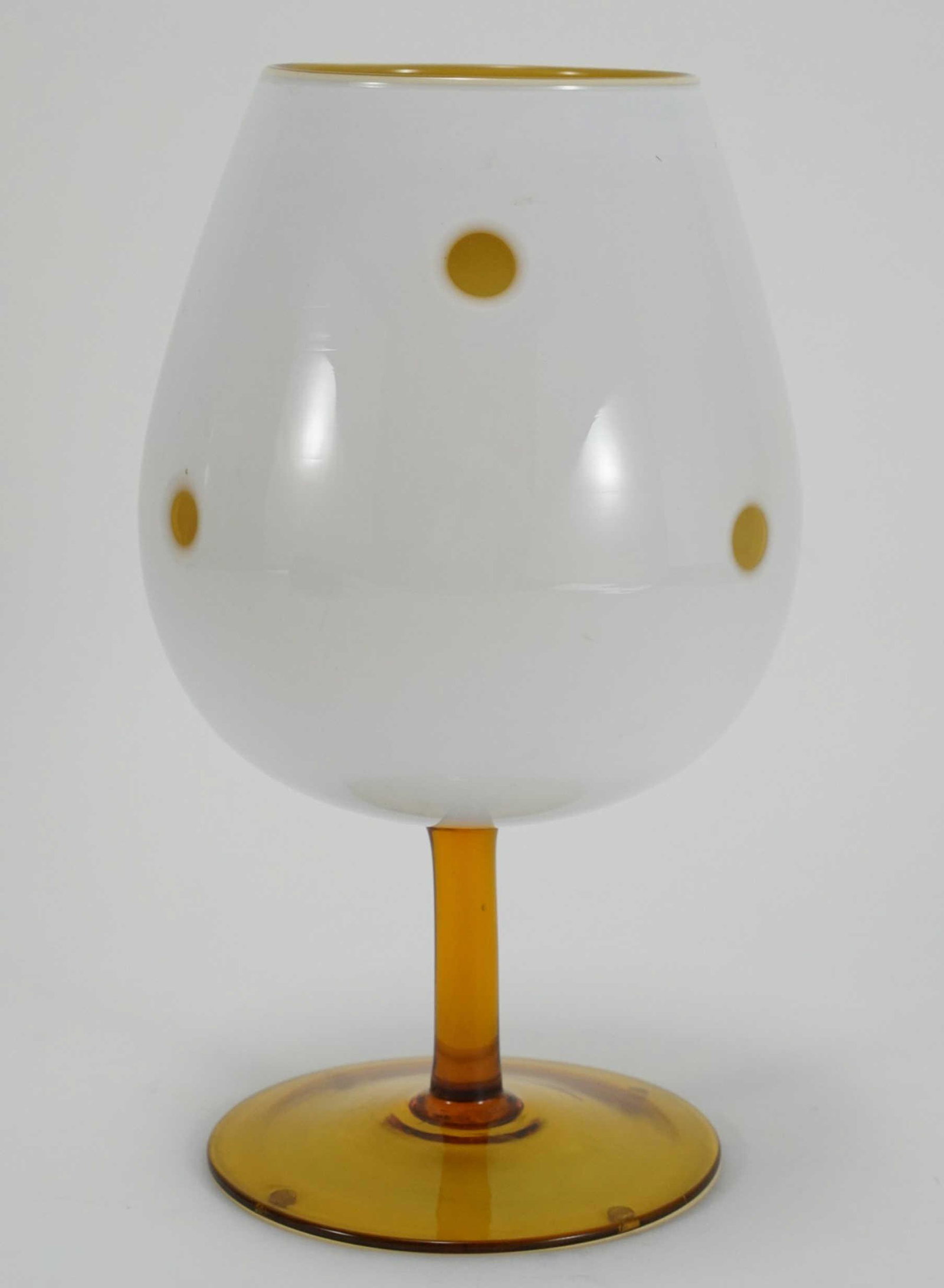 Mid Century Murano Cased Glass Oversize Goblet: Empoli style cased white over amber glass with round cut backs. Excellent condition. Mid 20th C. 11" H.