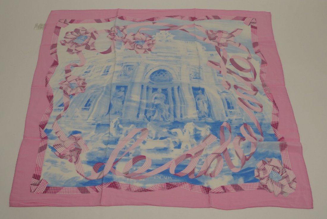 Escada Silk Scarf: "La Dolce Vita". Trevi fountain and ribbon motif in blue and pink. Hand rolled and stitched edges. Original Made in Italy tag. Excellent condition with no apparent snags, pulls, damage, etc. 34.5" x 3