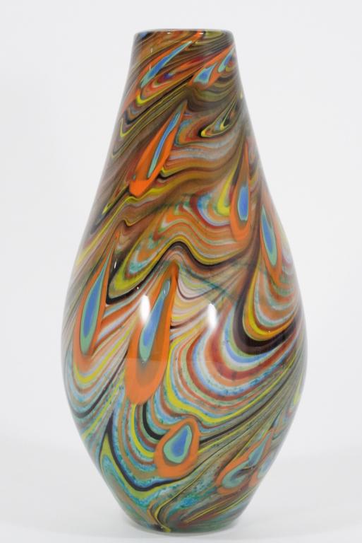 Murano Style Art Glass Vase: Hand blown clear cased glass over multi colored swirls. Red interior. Unmarked. 13.5" H.