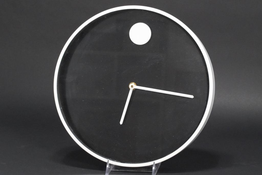 Howard Miller Museum Wall Clock: Designed by Nathan George Horwitt. Battery opereated movement; working. Howard Miller labels to the back. Very good original condition. 2 3/8" D x 12 3/4" dia.