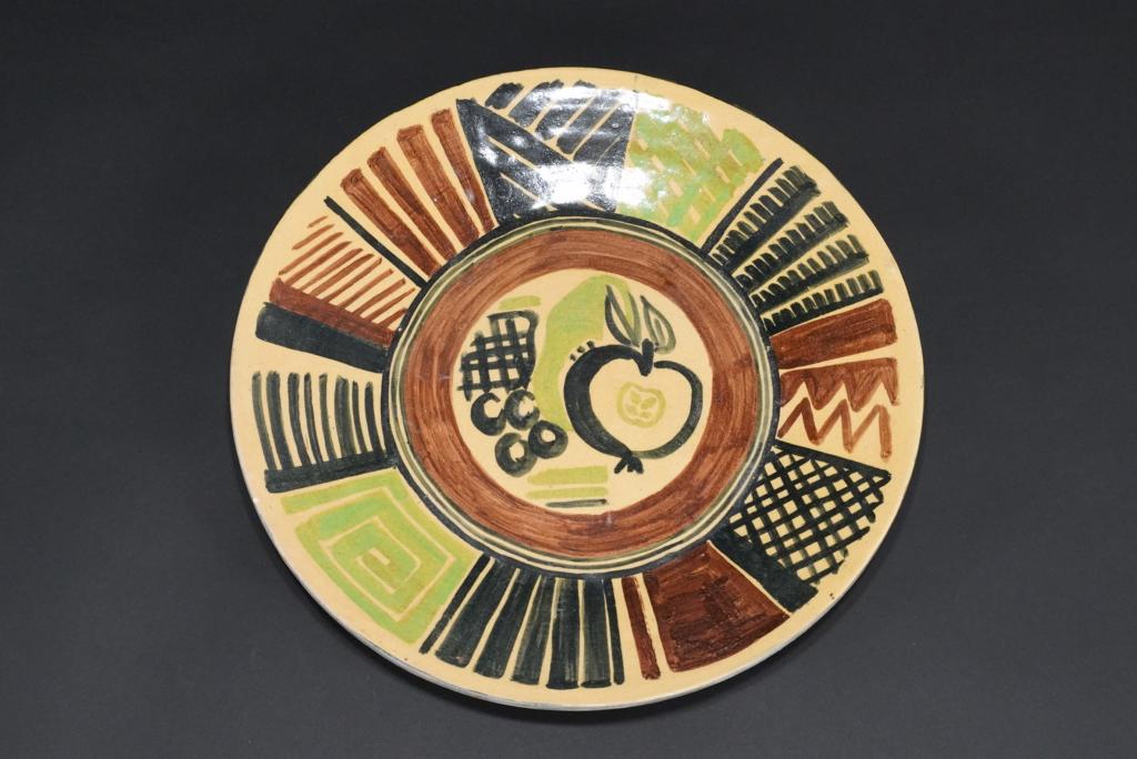 Vintage Large Pottery Charger Plate: Hand decorated pottery charger plate; probably French / European. Artist signed with initials to the back. Excellent condition with one small glaze flake at rim. Circa mid 20th C. 14.5" dia.