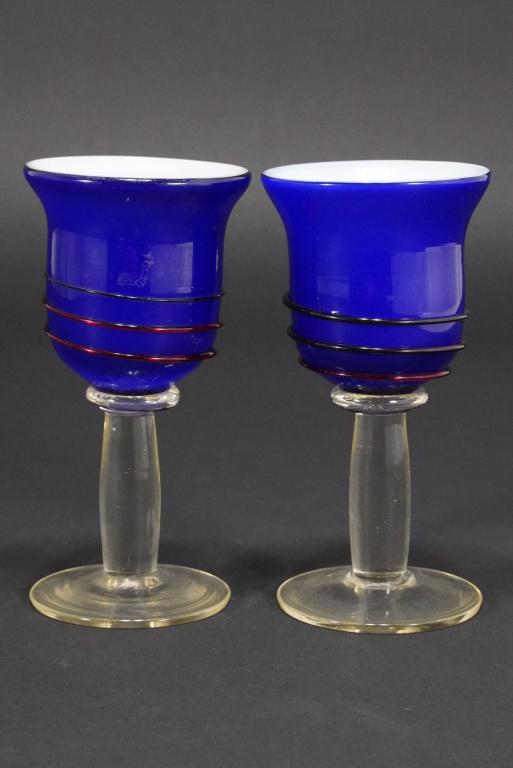 Studio Art Glass Goblets: Match pair in blue glass with applied threaded red swirl glass. White interiors; clear stems and feet. Unmarked. 6.5" H each.