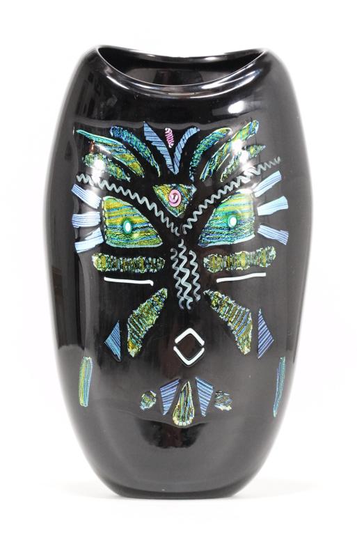 Dan BergsmaStudio Art Glass Mask Vase: Black glass vase with abstract African style mask in iridescent metallic glass pieces. No apparent signature or date. Excellent condition. 11.25" H x 6.75" x 3" approx.