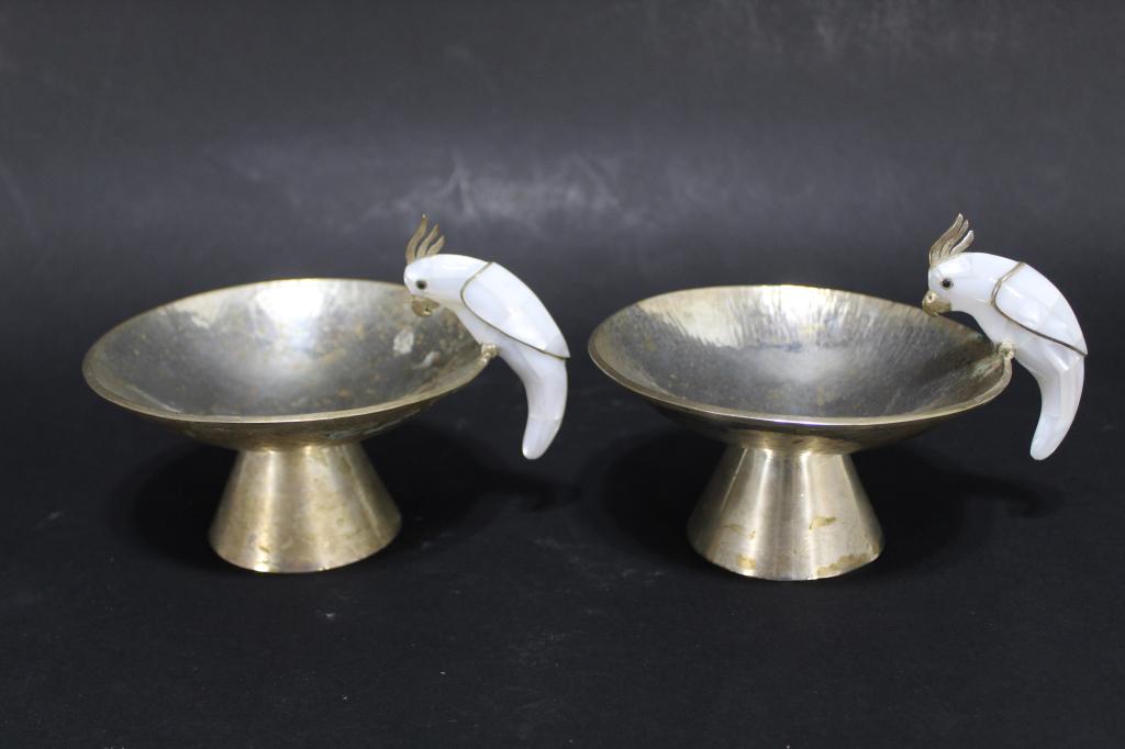 Los Castillo Mexico Style Bird Footed Bowls: Matched pair hand hammered silver plated footed bowls with mother of pearl inlaid cockatoo birds. Stamped HECHO EN MEXICO PLATEADO. Birds in excellent condition; silver plate with some wear, oxidation