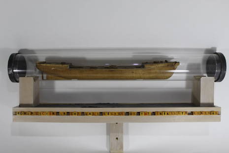 Robert McCauley (WA) Mixed Media Sculpture: "Romanticism in the Last Decade of the Twentieth Century". Plexi glass tube, found antique wooden model boat, wood, lead metal sheeting, Scrabble letter cubes, and screws. Tube section 37 1/2" L x 5 3