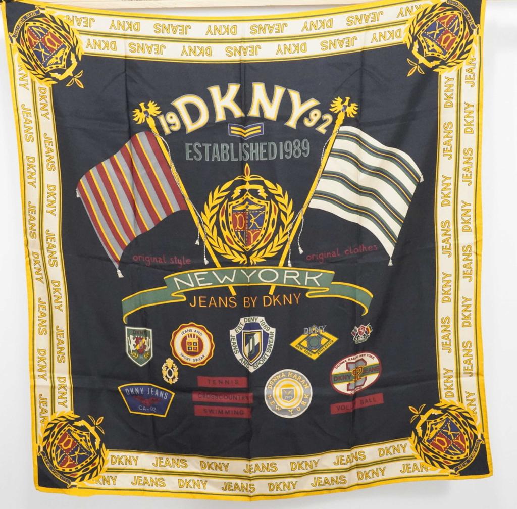 Donna Karan DKNY Silk Scarf: "Jeans by DKNY". Very good condition; small 1.75" area of hem undone bottom left corner. 35" x 35" approx.