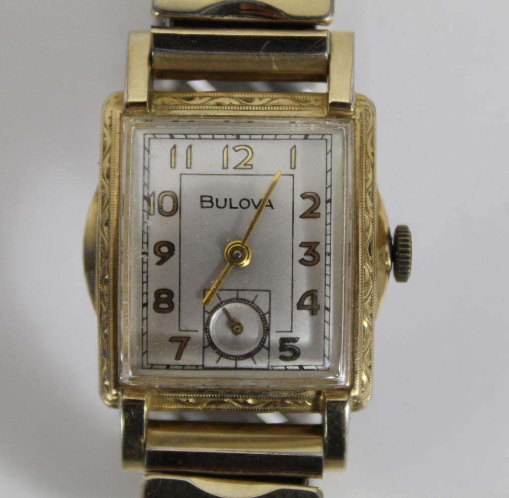 Vintage Bulova Art Deco Gold Filled Mens Watch: Engraved details to case sides. Face with lower second hand dial. Winds and runs but slowly loses time. Stainless steel back stamped 1695600. Expanding gold filled band by Kreisler. Face, case, and ba