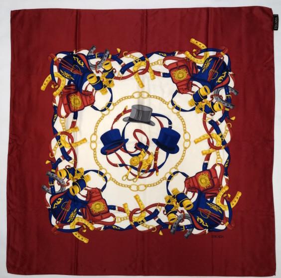 Escada Margaretha Ley Silk Scarf: Riding hat and horse equipment theme. Hand rolled and stitched edges. Original Made in Italy labels. Very good condition with no apparent pulls or holes (two faint spots lower right corner area). 41"