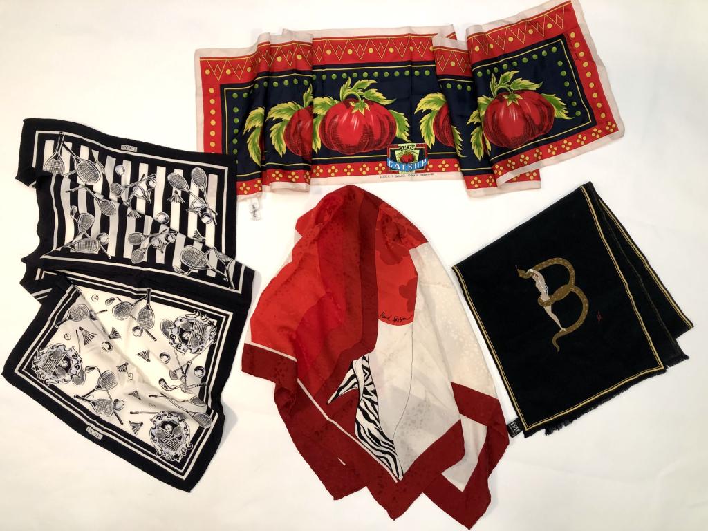 Erte Maud Frizon Escada Critchfield Silk Scarves: (1) Erte scarf with stylized "B" figure with original tag. Two small pin holes lower right corner. 10.25" x 51" approx. (2) Maud Frizon mod zebra shoe motif. Four small stains lower left corner. 32" x