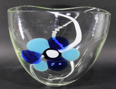 Ann Wahlstrom Signed Pilchuck Art Glass Vase: Thick clear glass in oval form with pinched opening. Flower design in dark blue, light blue, white, and black. Etched signature along with "PILCHUCK 2005" to bottom. Vertical light scuff/ scratch line