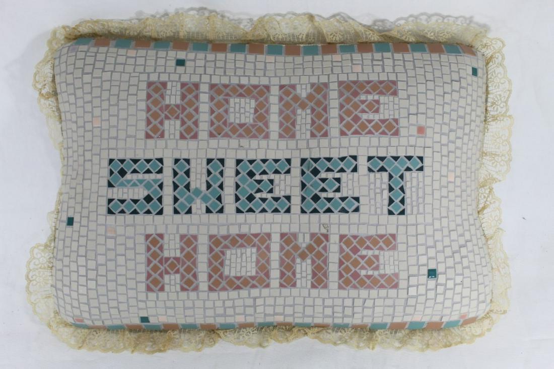 Mixed Media Sculpture of Pillow: "Home Sweet Home". Pillow form sculpture covered in grouted mosaic tile with lace trim. No apparent signature or date. Estate of Richard L. Weisman (1940-2018) art collection. 14" x 21" x 5.25" D appr