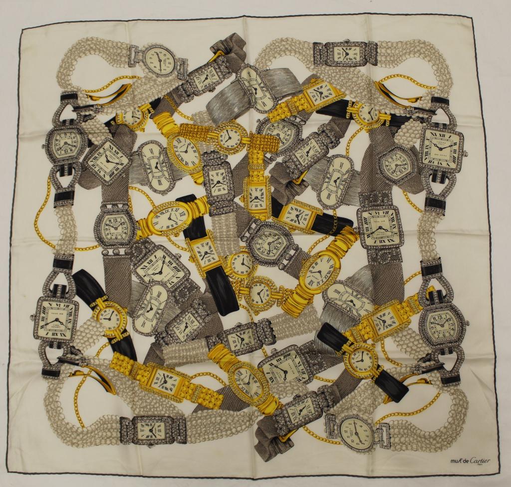 Two Must de Cartier Paris Silk Scarves: (1) Watch motif design. Hand rolled and stiitched edges. Two small pin holes upper left and small brown stain center left edge; otherwise good condition. 33" x 34" approx. (2) Double "C" center design