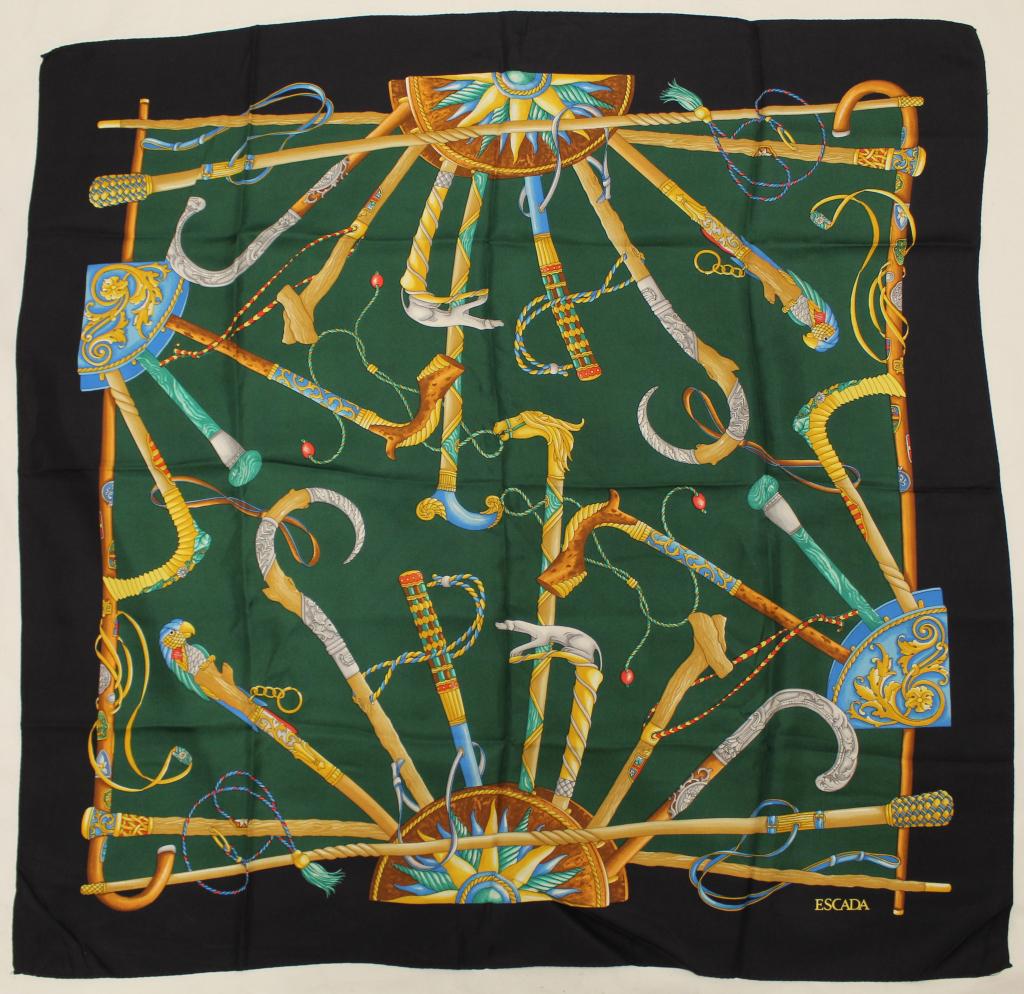Escada Silk Scarf: Walking stick and cane motif. Rolled and stitched edges. Very good condition; two tiny pin holes upper right corner. 33.5" x 34" approx.