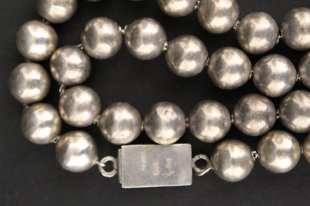 Vintage Taxco Mexican Ball Bead Necklace: Necklace with 54 sterling ball beads (12mm approx.) on chain. Slide clasp stamped Mexico and 925 (along with numbers). 92 grams approx. Good condition with no apparent dents, damge, etc. 28" L (exclud