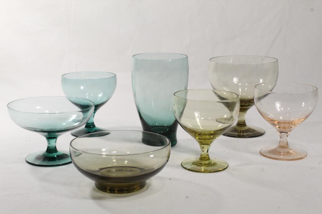 Russel Wright AMERICAN MODERN Glassware: Group of 7 pieces in various colors by Morgantown. Includes three 3 1/4" wine glasses, one 4 1/8" water goblet, one 2 5/8" champagne / tall sherbet, one 1 7/8" x 4" dia. dessert bowl, and one 4 1/2" j