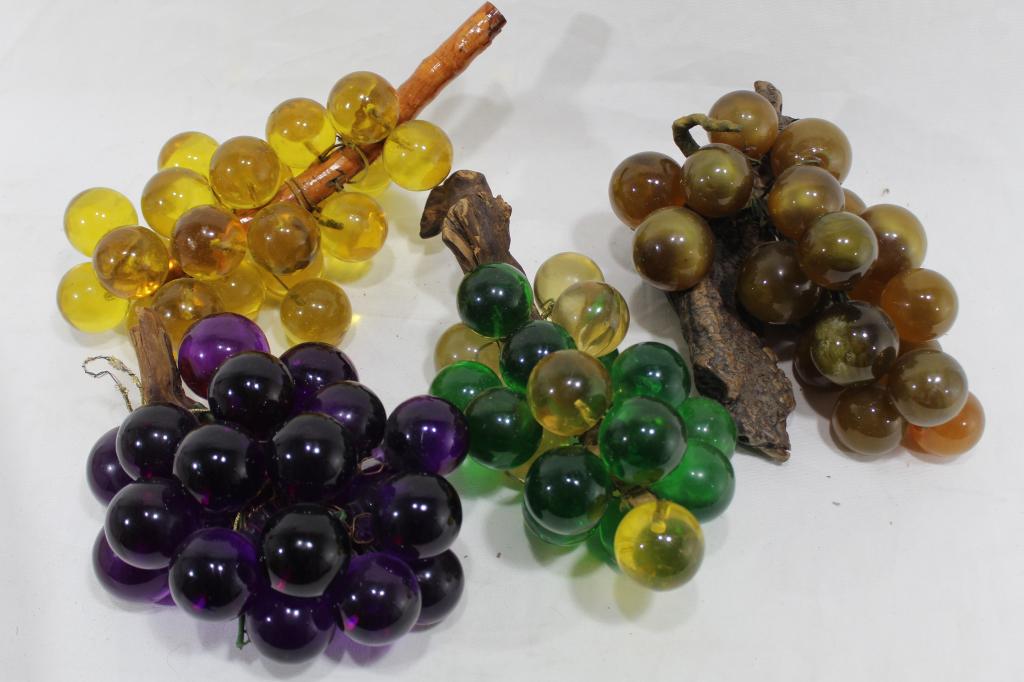 Vintage Resin Grape Clusters: Four clusters; yellow resin grapes with wood stem, green/ yellow resin grapes with wood stem, opaline amber grapes with burl wood stem, and purple resin grapes with wood stem. Good condition; some sur