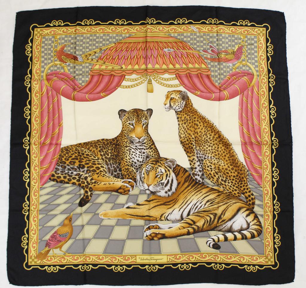 Salvatore Ferragamo Silk Scarf: Tiger, cheetah, and leopard under a draped canopy. Hand rolled and stitched edges. Original Made in Italy label. Small pin hole at left side edge; otherwise very good condition. 34" x 34" approx.