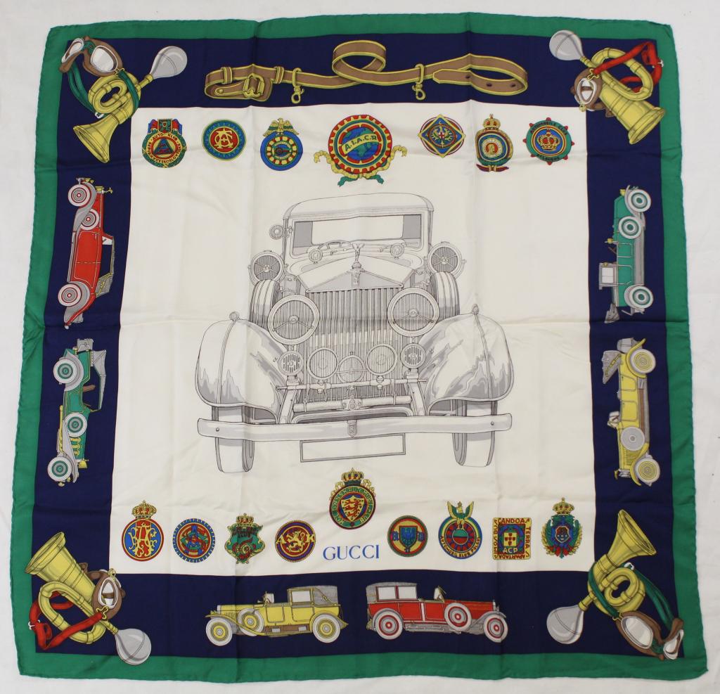 Gucci Rolls Royce Silk Scarf: Rolls Royce and badge design with green border. Hand rolled and stitched edges. Original Made in Italy label. Very good condition with no apparent spots, pulls, holes, etc. 34.5" x 35" approx.