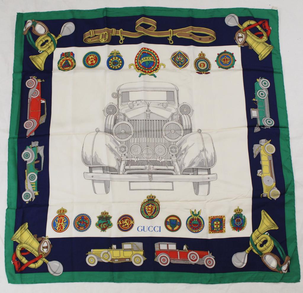 Gucci Rolls Royce Silk Scarf: Rolls Royce and badge design with green border. Hand rolled and stitched edges. Original Made in Italy label. Very good condition with no apparent spots, pulls, holes, etc. 34.5" x 35" approx.