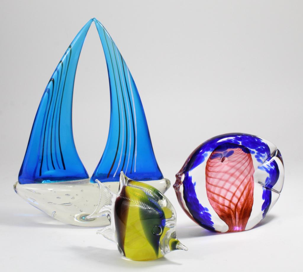 Murano Style Glass Fish & Sailboat: (1) Fish with yellow, blue, amethyst, and green interior. 3.25" H. (2) Abstract fish with twist swirl interior. 4.5" H. (3) Sailboat with striped sails. 9.97" H. All unnmarked and in excellent conditi