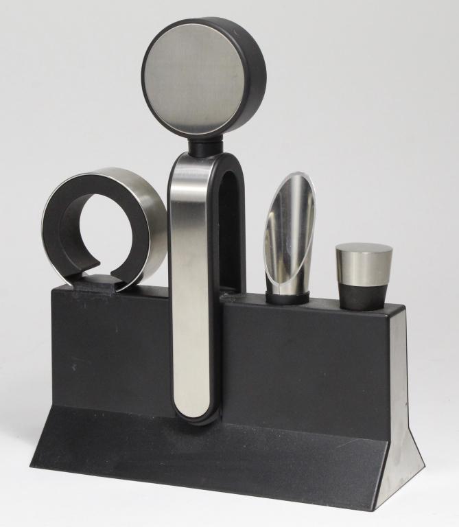 Rosendahl Denmark Grand Cru Wine Accessory Set: Black plastic with stainless trim. Designed by Erik Bagger. Includes foil cutter, bottle stopper, corkscrew, and funnel spout along with stand. Very good condition with light signs of use.