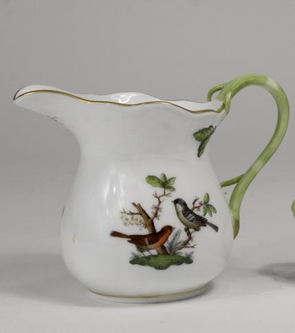 Herend ROTHSCHILD BIRD Porcelain Creamer: Herend hand-painted porcelain creamer in the "Rothschild Bird" bird pattern, having white ground with bird, butterfly, and insect motifs and gilt rim. Stamped and impressed Herend Hungary and hand num