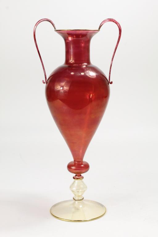 Tall Lampwork Glass Amphora Vase: Hand blown glass classical style amphora vase in red with clear base. Gilt trim to lip. No apparent signature. Excellent condition. 15" height at handle top.