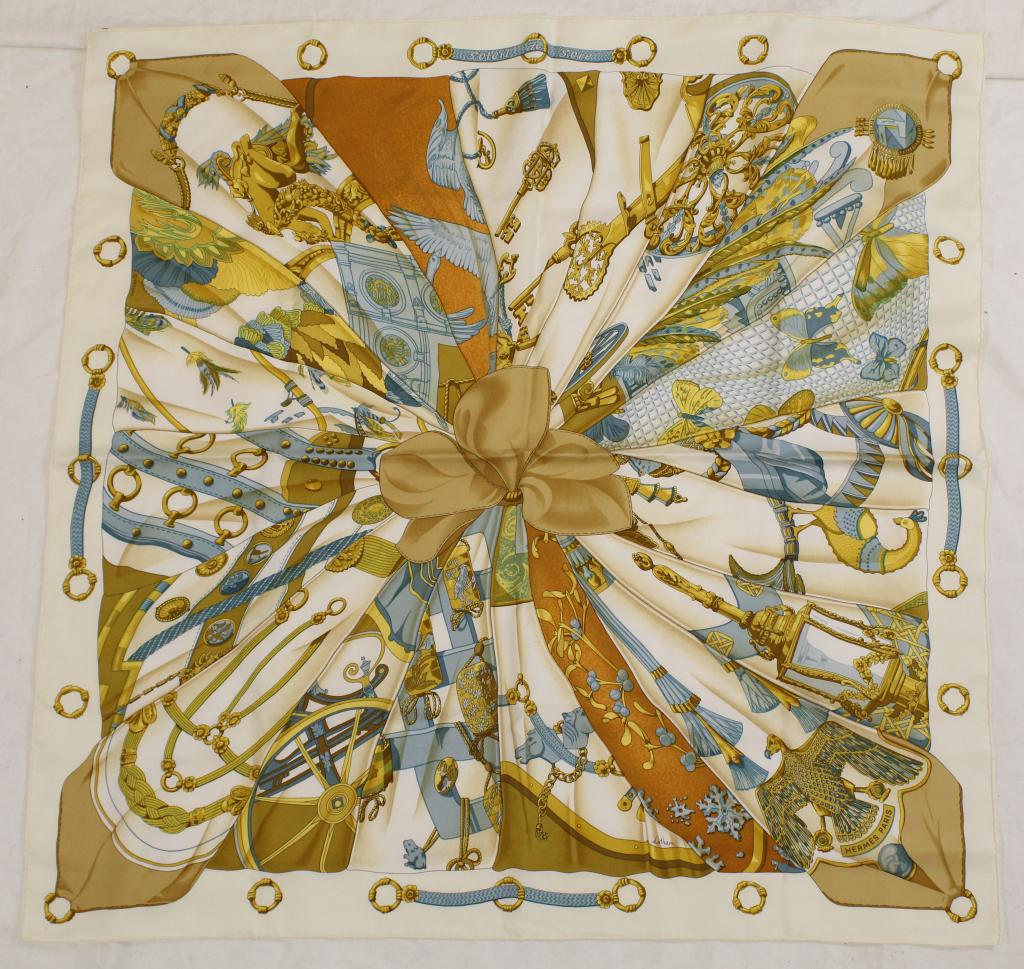 Hermes Soleil Soie Silk Scarf: Designed by Caty Latham. Hand rolled and stitched edges. Original Made in France label. A few tiny spots lower left corner, tiny spot upper right corner, 2" vertical pulled thread with ting snag hole