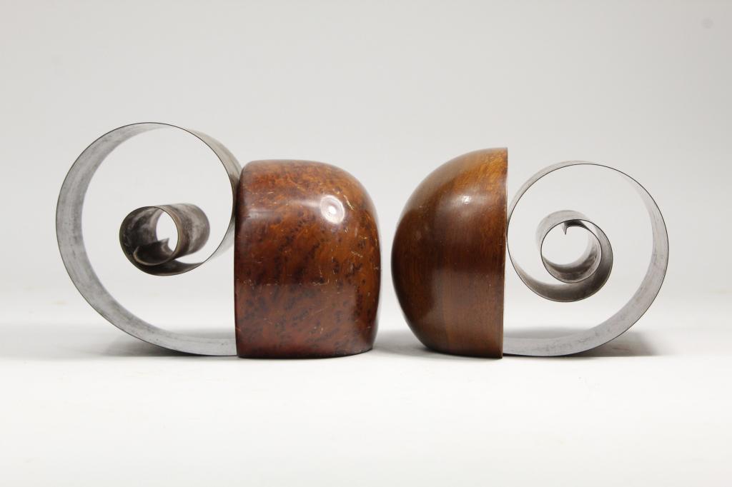 Fred Farr / Revere Art Deco Bookends: (1) Solid redwood burl end with patinated copper metal coil. Stamped to bottom. (2) Solid mahogany end with patinated copper metal coil. Stamped to bottom. Both in very good original condition with no