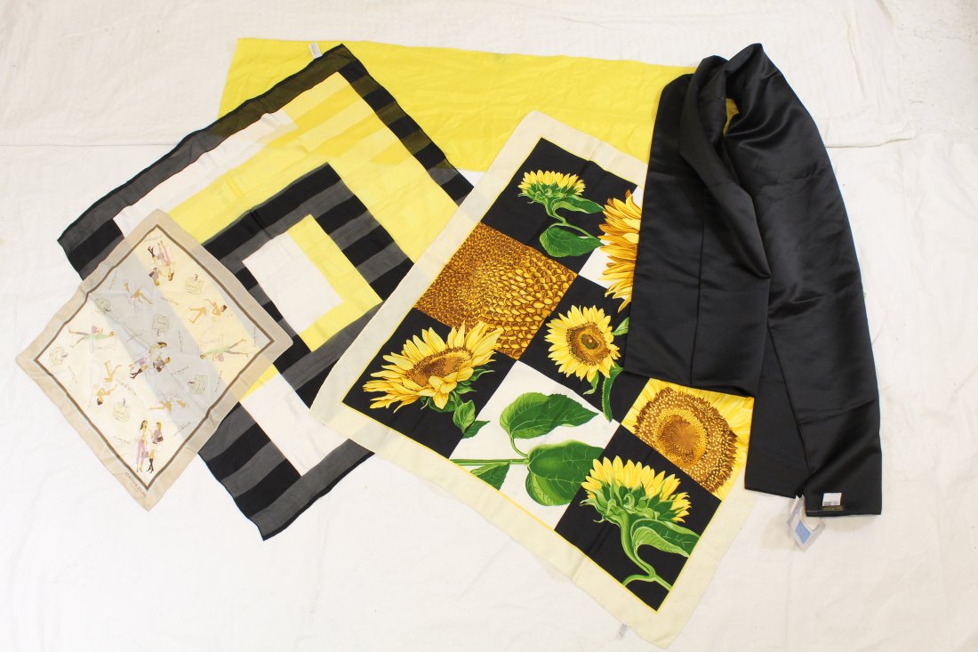 Magnin/ Oscar/Celine etc. Scarves & Wraps (5 pc): Jessica McClintock black matte satin stole with store tags, mint (17.75 x 76"). In yellow are I.Magnin silk neck scarf (13 x 51"), Oscar de la Renta silk print (33 x 34"). Celine of Paris silk sunflow