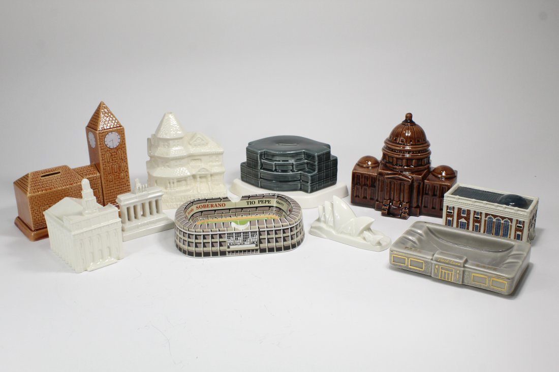 Collection 10 Vintage Souvenir Buildings: Collection of 10 ceramic buildings including bank buildings, stadium and Brandenburg Gate. Chip to base of Borel Bank. Largest 7"l x 7.5"h.
