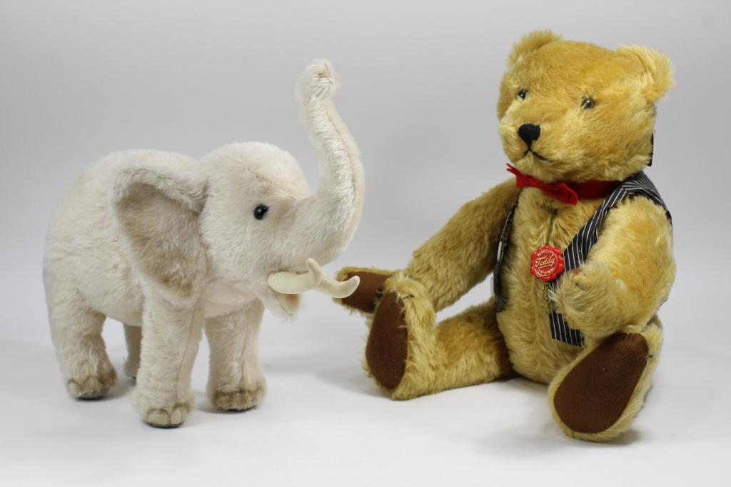 Vintage Hermann Teddy Bear & Steiff Elephant: (1) Long pile gold mohair growler teddy bear with red bow tie and cloth vest. Fully jointed. Original red plastic tag. Numbered 1372 out of 2000. Excellent condition. 22" approx. (2) Limited edition S