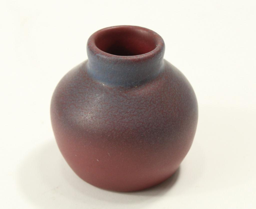 Van Briggle Art Pottery Miniature Vase: Vase in matte mulberry glaze. Incised marks to bottom. Excellent condition. 1 3/4" H approx.