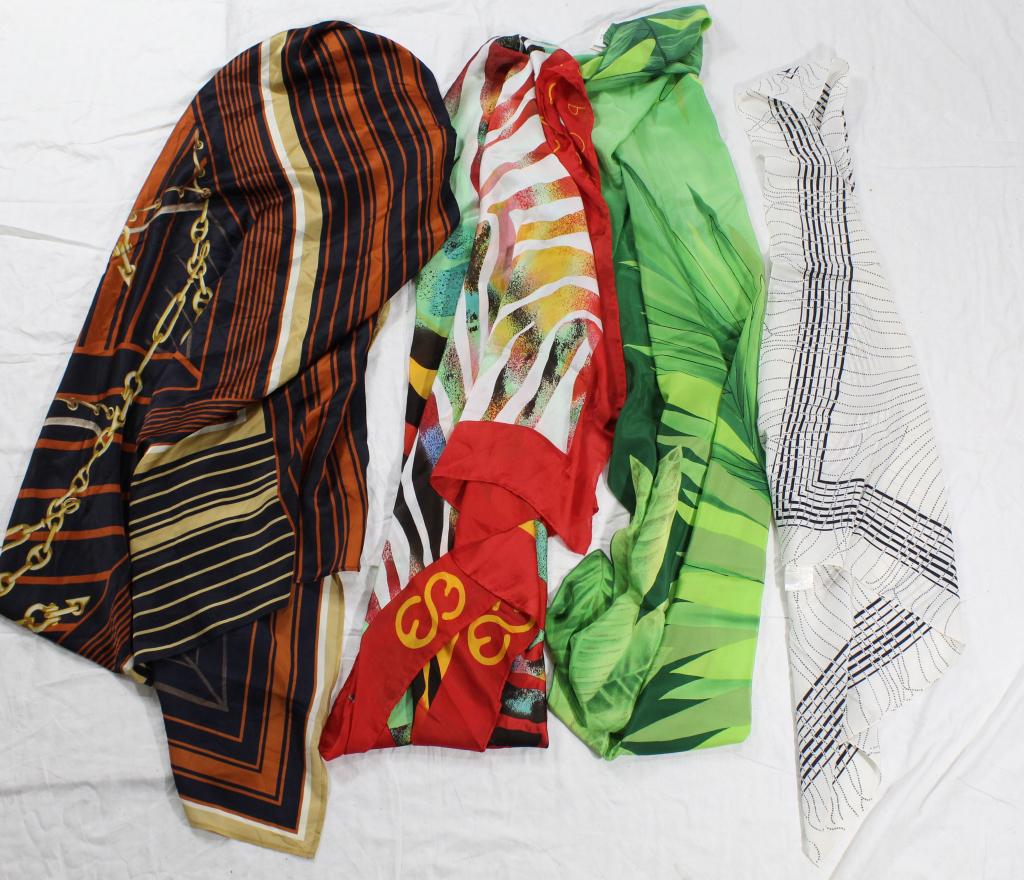 Four Silk Scarves: Two are by Escada: a hemmed white silk with navy dots 34" sq. and a red silk hemmed 61" x 45". Two silk scarves labeled Gottex incliude a green leafy pattern 28" x 56" and a charmeuse in black terraco