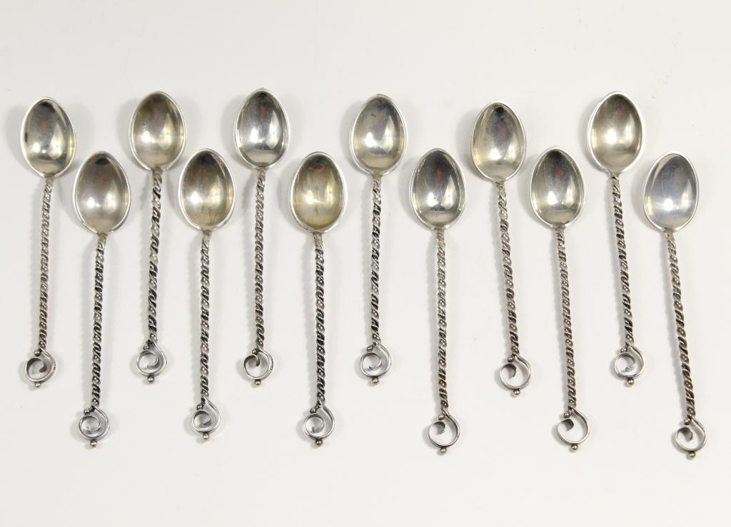 Norway 830 Silver Demitasse Spoons: Set of 12 spoons with twist handles and curl ends. Marked TB830S. Very good condition. 73 total grams approx. 3.75" L.