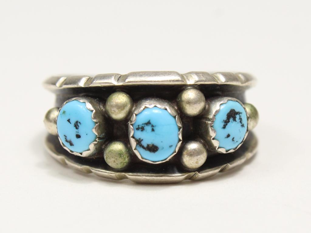 Southwest / Navajo Turquoise & Sterling Ring: Sterling band set with 3 turquoise stones and 6 round bead balls. Marked STERLING. 4 grams total weight approx. Size 9.5" approx. Band 3/8" at widest point.