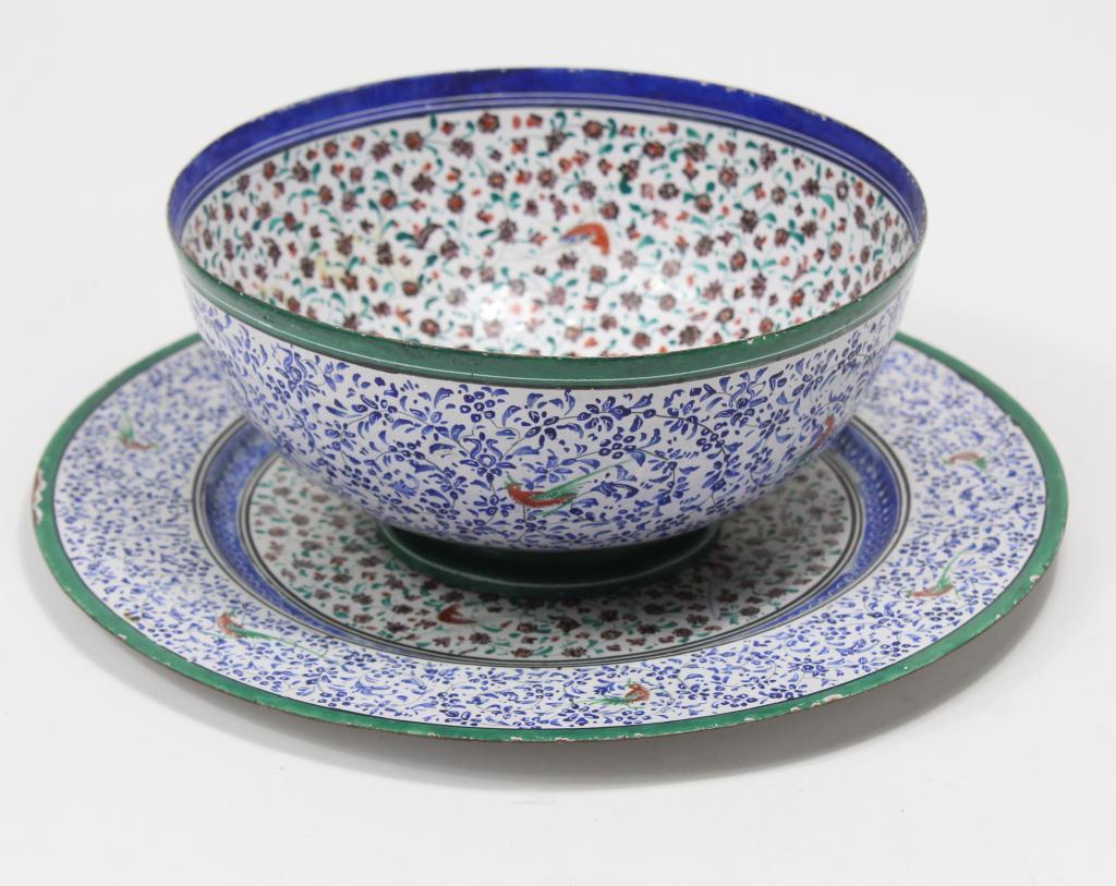 Persian Blue Enamel Copper Bowl Underplate 19th c: Persian Enamel on thin Copper Bowl with a Underplate 19th c with an overall design of blue vine and floral , surface wear , nicks to the enamel on plates rim undeneath fritting to upper rim bowl, late