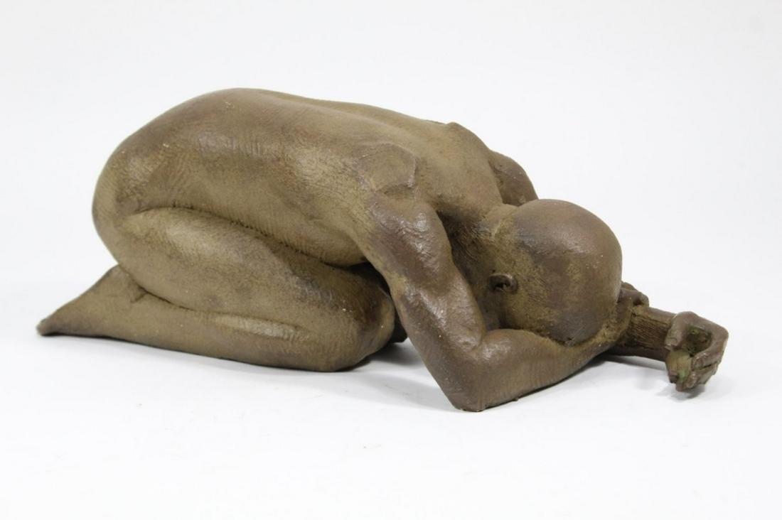 Male Nude Artist Signed Clay Sculpture: Hand formed clay sculpture of male nude crouching with head down. Matte brown tone glaze. Signed Cunningham and dated '88 to foot. Excellent condition; a few pinpoint glaze flakes. 5 1/2" h x 16" L x 
