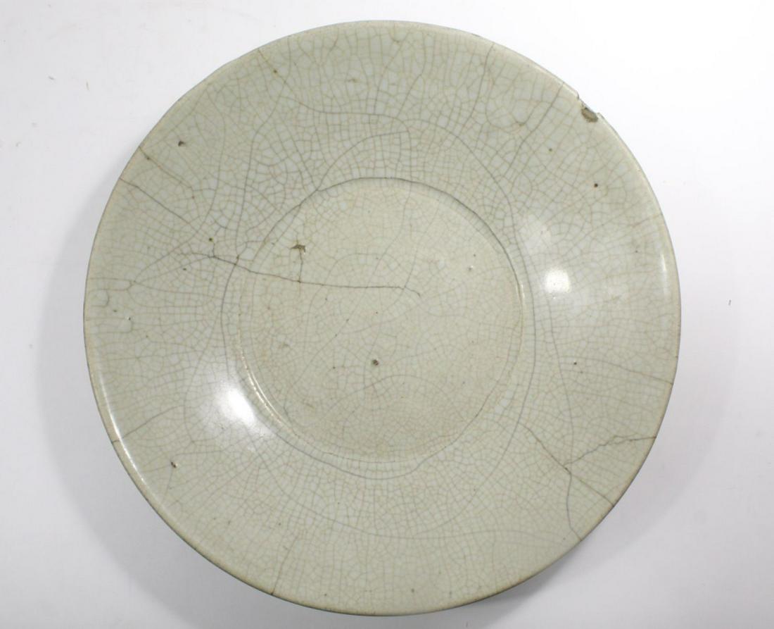 Chinese Celadon Crackleware Charger Qing Dyn: Chinese Celadon Crackleware Pottery Charger dating from the Qing Dynasty, crackle in black and brown the black going through top and base, one chip and one outer rim nick, glaze wear and misses, 13" d