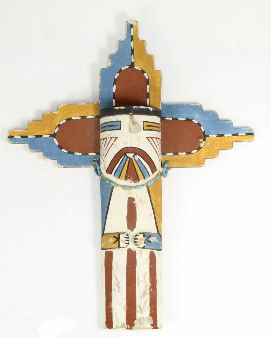 Hopi Hand Carved and Painted Totem: Unsigned, brown, blue and mustard colors. Wear to piece, detached wing at seam. Measures approx 16" tall and 13" wide at the wings.
