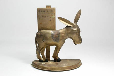 Mechanical Donkey Cigarette Dispenser: Circa 1920's, vintage mechanical donkey cigarette dispenser and match holder. Pull donkey's ear downward and cigarette dispenses from rear end. Possibly made by Swartz, good condition for age, shows w