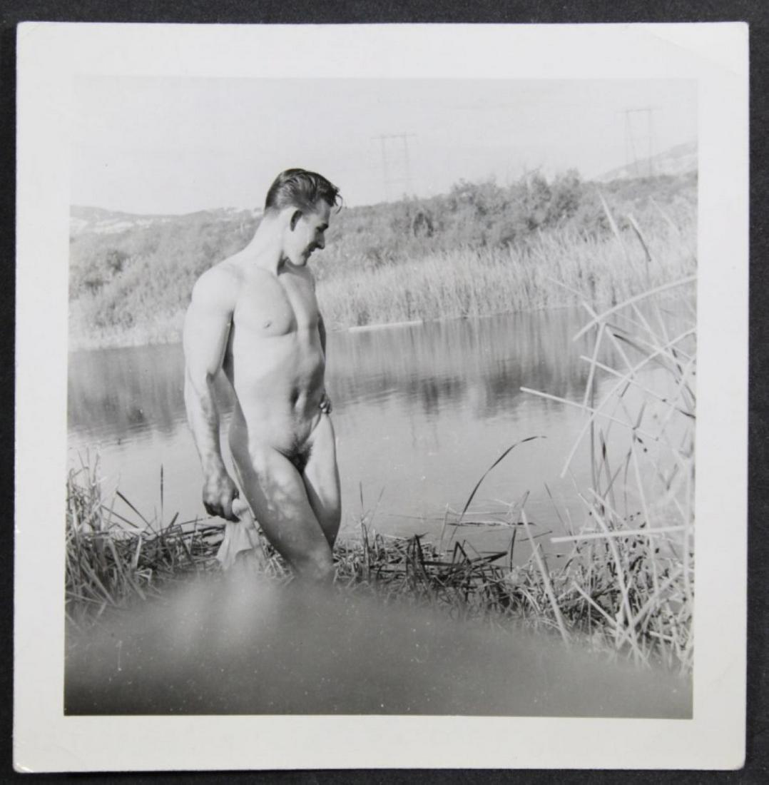 Vintage Male Nude Snapshot Photograph 1950's: Male nude posed in lake with legs crossed. Excellent clear sharp image (with negative blur flaw to lower portion) on gloss Kodak Velox paper. 1950's. 3.5" x 3.5".
