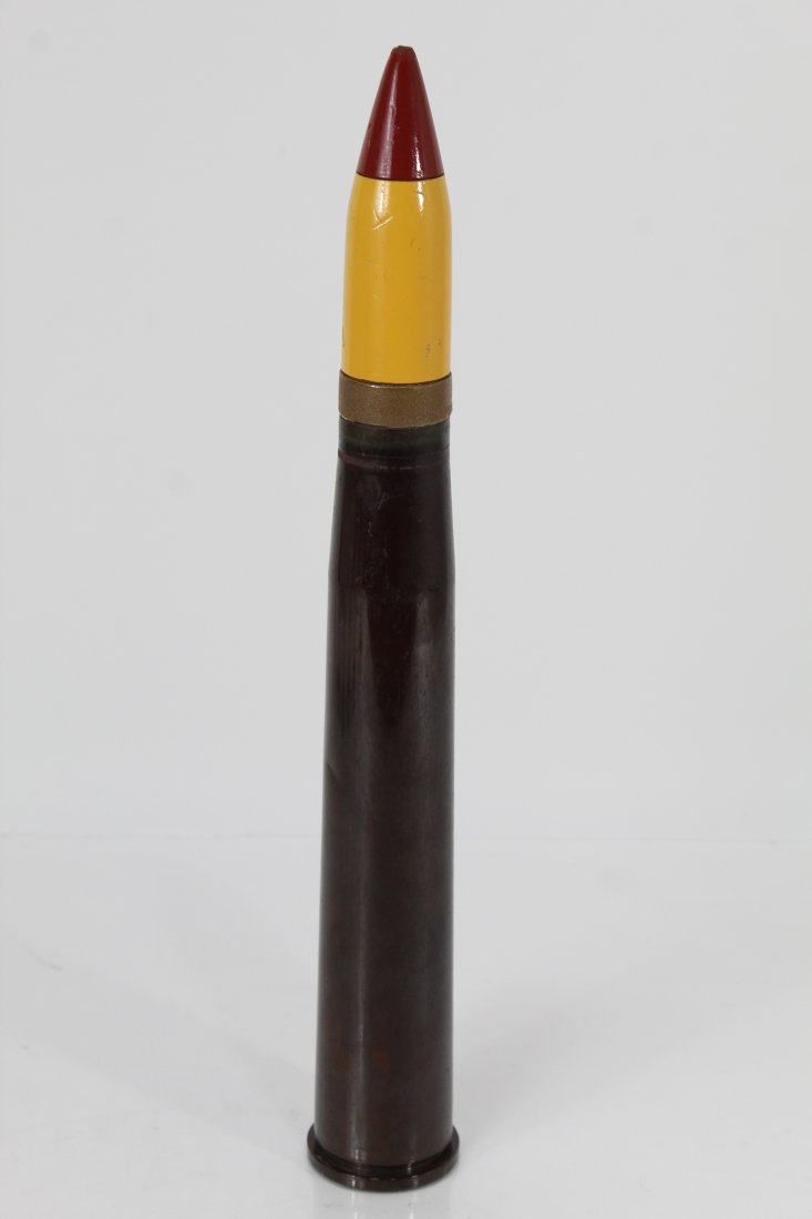 Military 40MM MK 3 Casing w/ Wood Shell: Vintage anti-aircraft cartridge case with painted wood replica projectile. Probably used for military demonstration purposes. Stamped to bottom along with 330825 LOT 95 12 55. Printed to side UD-63 Mc