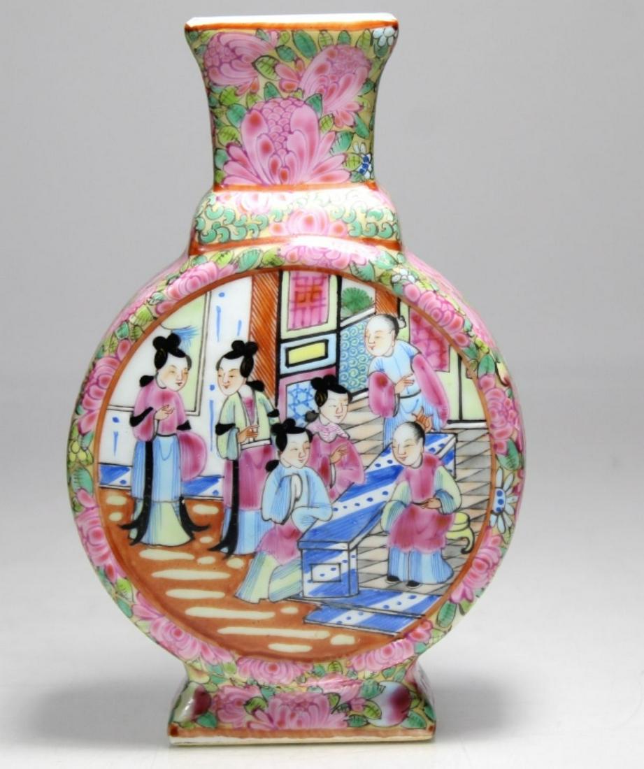 Chinese Famille Rose Porcelain Moon Flask Vase: Hand painted court figure scene medallions to each side. Pink and green foliage sides. Unmarked. Excellent condition. 6.75" H x 4.25" x 2" approx.