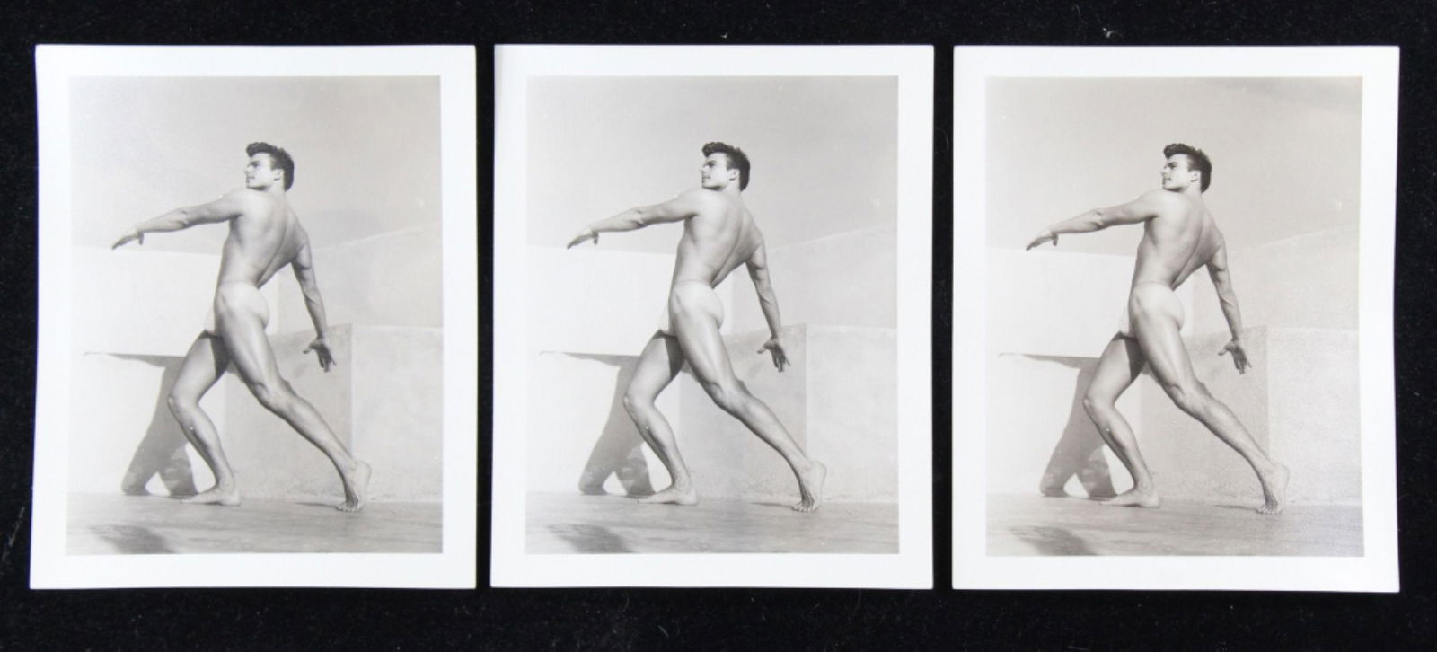 Bob Mizer / Bruce of Los Angeles Male Nude Photos: Group of 3 identical photographs of a nude model posed outdoors (1 photo with slight developing tone flaw). All pencil numbered XGII-H 81 to the reverse. Clear sharp silver gelatin prints on heavy fib