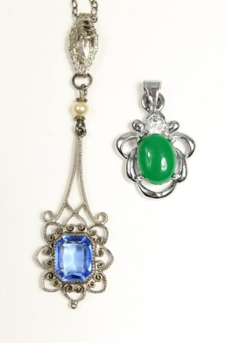 2pc Sterling and Stone Pendants: 2pc Sterling and Stone Pendants. Includes (1) FIligree pendant with emerald cut sky blue spinel 32x14mm and (2) Jade Cabochon Pendant 24x14mm. Excellent condition.