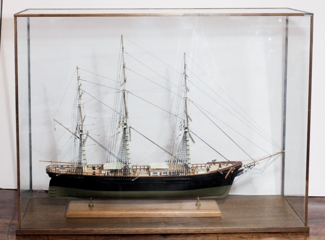 Large Sailing Ship / Clipper Model: Handmade wood 3-masted sailing ship / clipper model. No apparent name. Mounted to mahogany base. Glass case with mohagany trim and base. Ship 25.5" H x 36" L approx. Glass case 30" H x 39.5" x 12.5".
