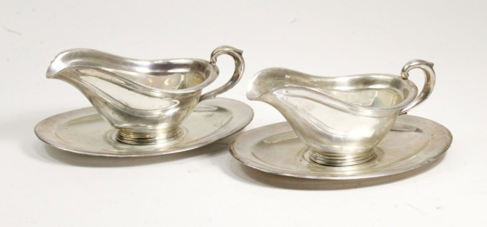 Pair Old Reed & Barton Sauce / Gravy Boats: Matched pair sterling sauce boats with separate liner plates. Stamped with old Reed & Barton marks, STERLING, and X525. One liner plate with date symbol for 1936; all other pieces with 1937 symbols. E